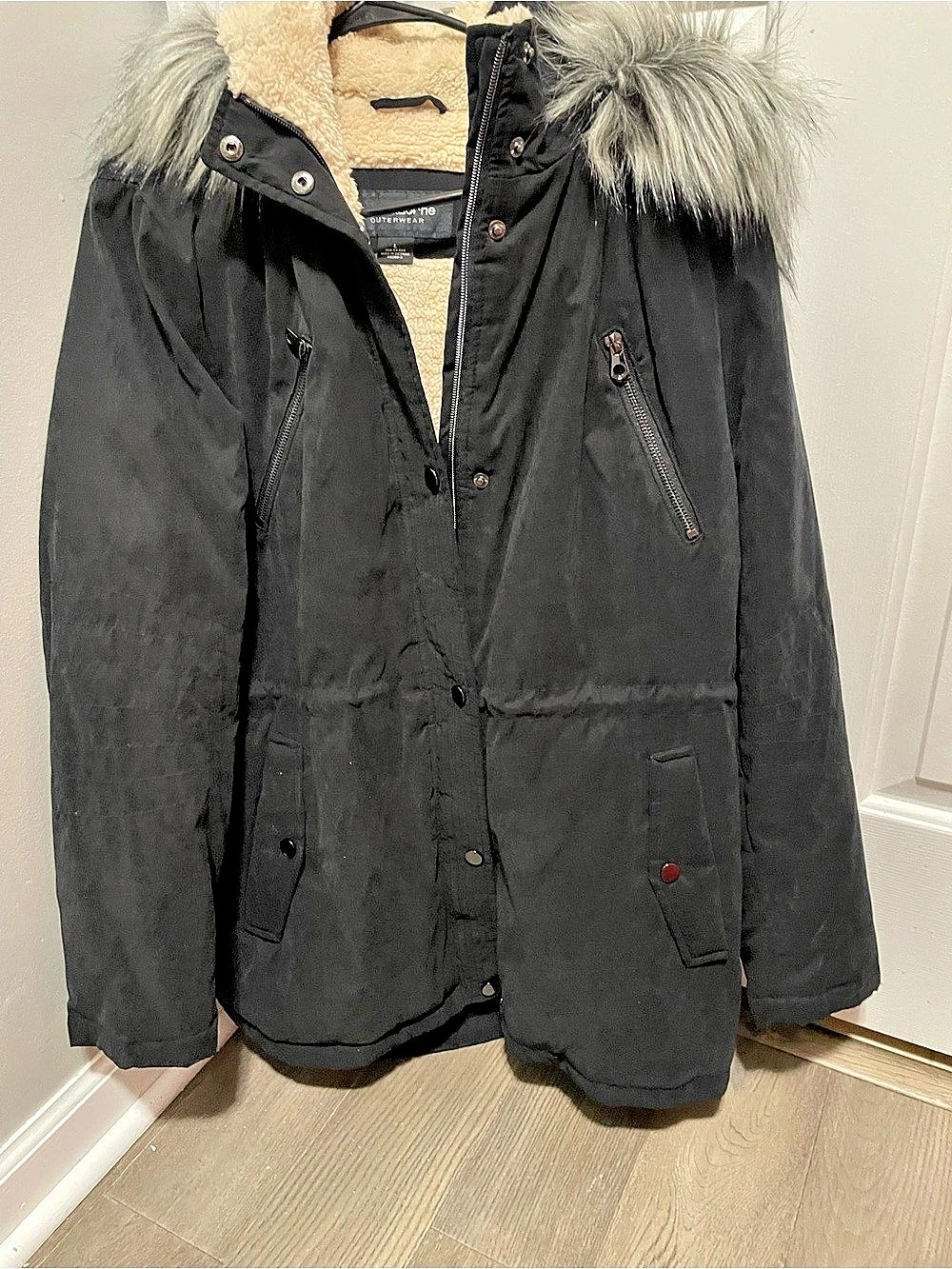 Liz Claiborne winter parka featuring a cozy faux-fur-trimmed hood and a soft fle